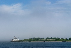 Fog Lifting by Rose Island Light in Rhode Island